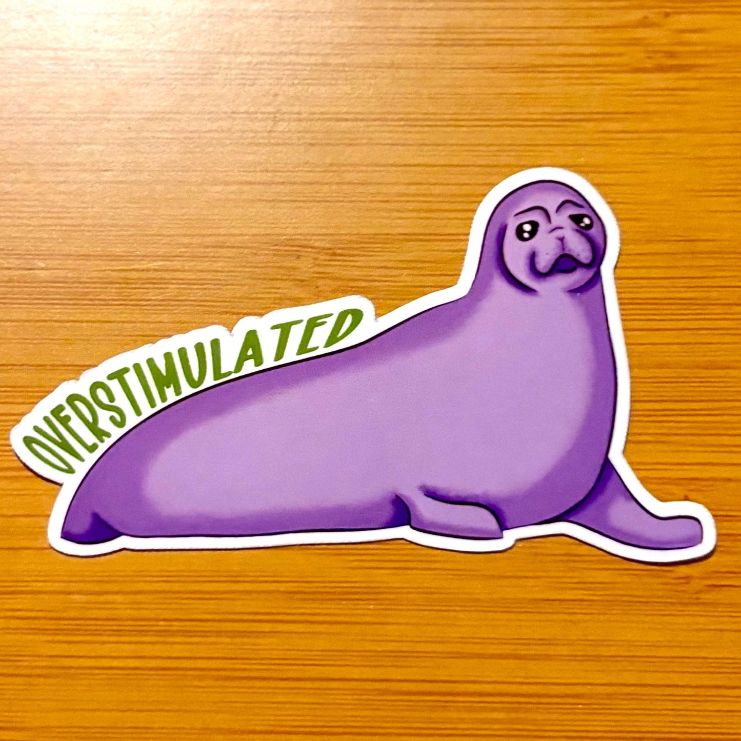 overstimulated - purple crabeater seal 3” glossy vinyl laptop water bottle sticker decal