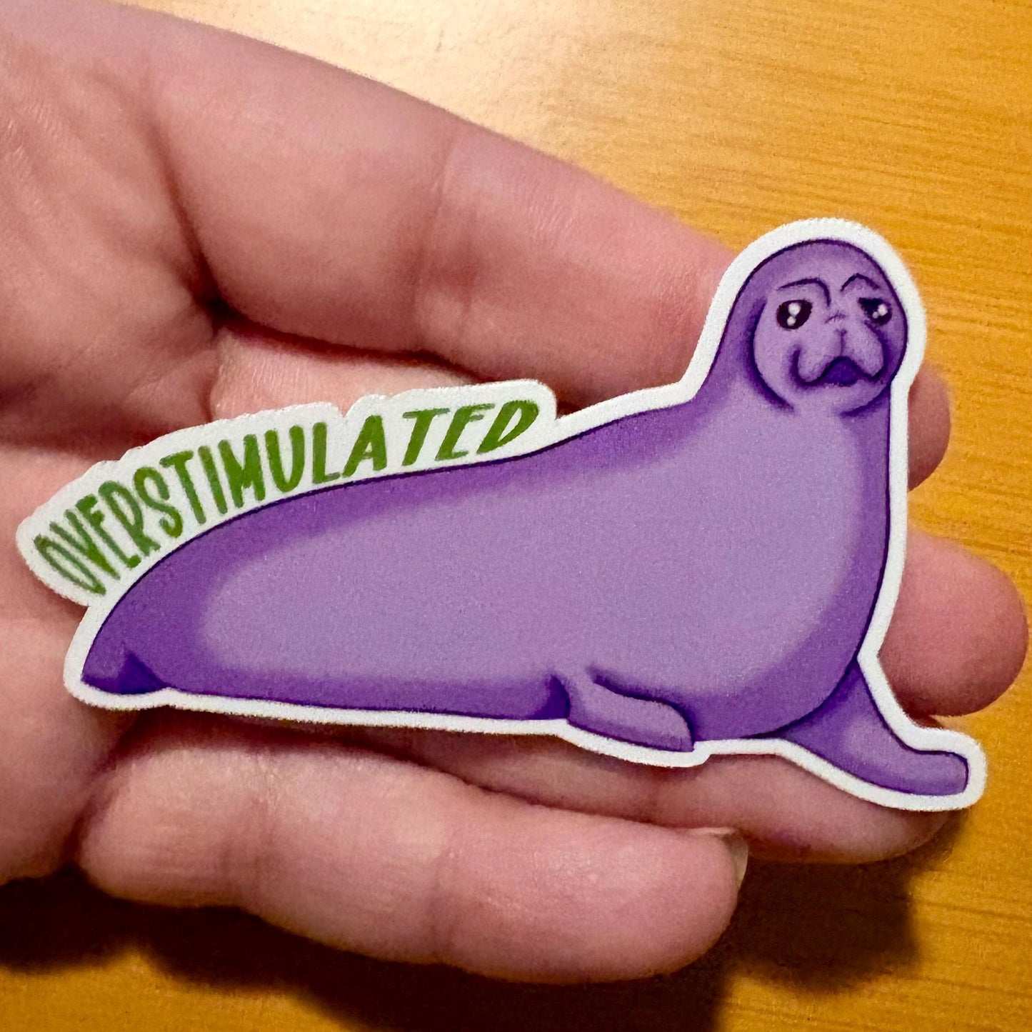 overstimulated - purple crabeater seal 3” glossy vinyl laptop water bottle sticker decal